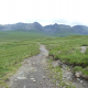 Take time to look back and admire the towering peaks